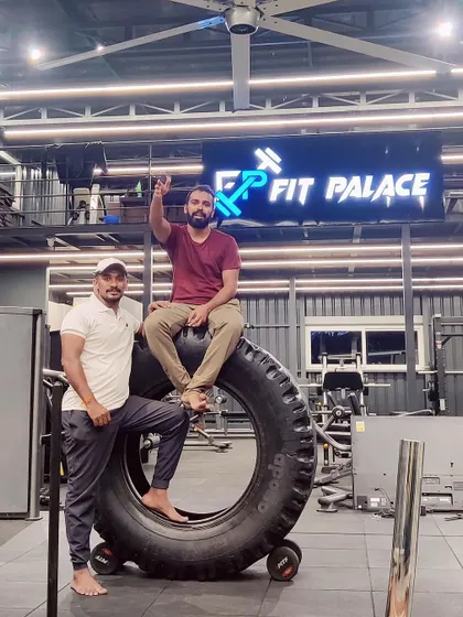 Posing with a friend at Fit Palace, celebrating our shared fitness goals.
