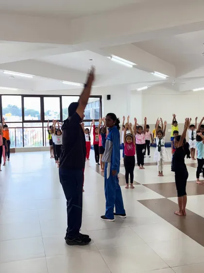 A typical class starts with everyone in sync. I lead the children through warm-ups and stretches, making sure they learn the importance of preparing their bodies for exercise.