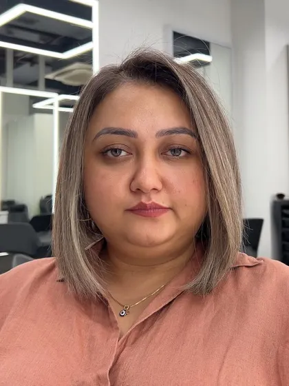 A happy client with her new ash blonde bob. The color is flattering and the style is timeless.