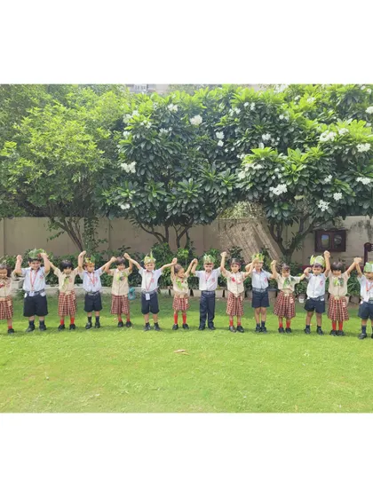 Our young eco-warriors stand together, united in their celebration of Van Mahotsav, raising their hands for a greener planet.
