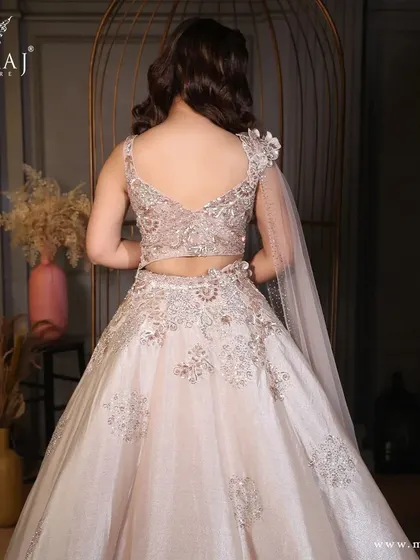 The back view of the shimmery crop top lehenga, showcasing its elegant design and craftsmanship.