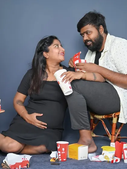 A creative and funny theme celebrating pregnancy cravings with fast food. It's a unique memory for couples with a sense of humor.