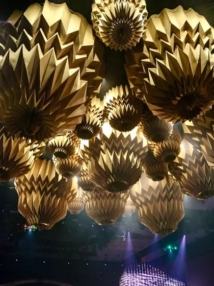 A view looking up at the custom-made origami chandeliers that dominated the ceiling space.