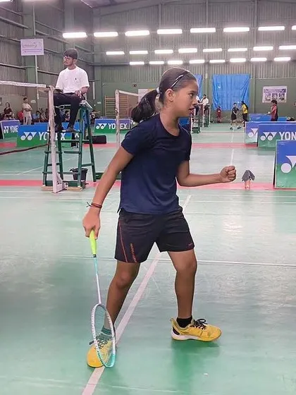 The raw emotion of competition. A player celebrates winning a tough point during the YONEX SUNRISE tournament.