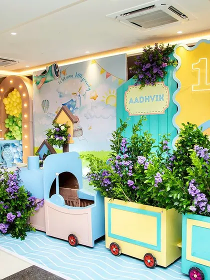 All aboard for Aadhvik's first journey! This adorable travel-themed party features a pastel train, a hot air balloon, and a soft, dreamy backdrop for a gentle and whimsical adventure.