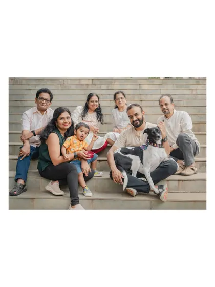 A beautiful multi-generational family portrait on the steps, with their beloved dog right in the middle of it all. These are the photos that become a family's legacy.