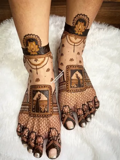 A traditional foot design featuring peacock motifs within squares and a lotus anklet pattern.