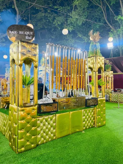 A wide view of our opulent golden barbecue station, designed to make a luxurious statement at any event.