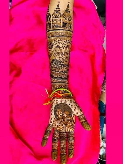 A close up of a single arm, showcasing a detailed portrait of a couple, a scene with two women, and architectural dome motifs, perfect for telling a rich story.