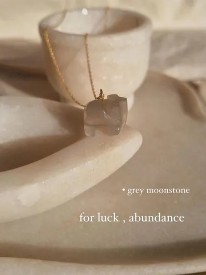 Another view of the Grey Moonstone elephant pendant, a stone for luck and abundance.