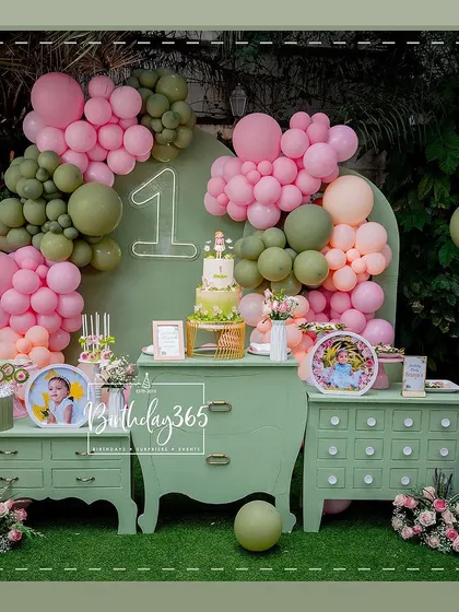 A duplicate of image 11, showing the elegant first birthday setup.