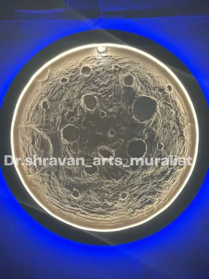 This moon mural is enhanced with dual-color LED lighting. The warm inner glow highlights the texture, while the cool blue backlight creates a beautiful halo effect against the dark wall.