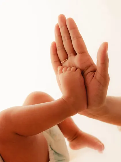 See how perfectly a tiny foot fits in the palm of your hand. My goal is to capture this exact scale and detail in a beautiful 3D foot sculpture you can hold onto long after they have outgrown your lap.