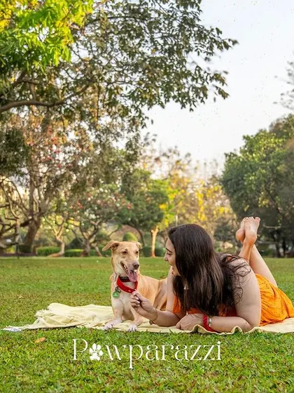 A relaxed moment during an outdoor picnic shoot with Noor the Indie dog. These sessions are all about enjoying the day and letting the beautiful moments happen naturally.