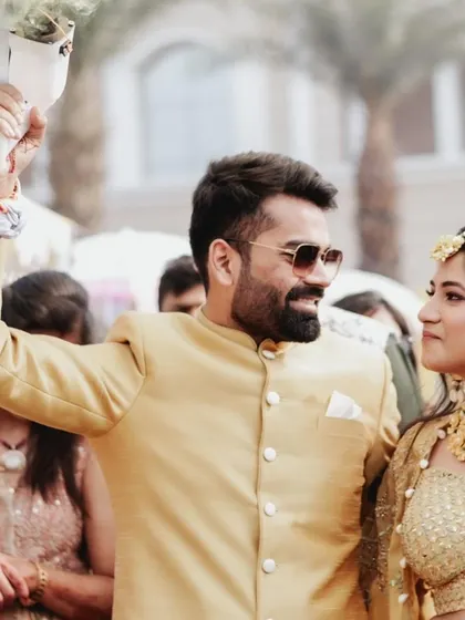 The groom, full of energy, celebrates during his Haldi ceremony. These photos are all about capturing the festive spirit.