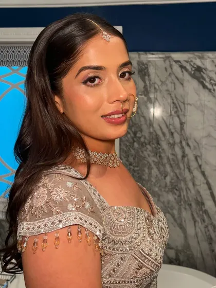 A beautiful smile from the happy bride. Her makeup is designed to look fresh and radiant all through the night of her reception.