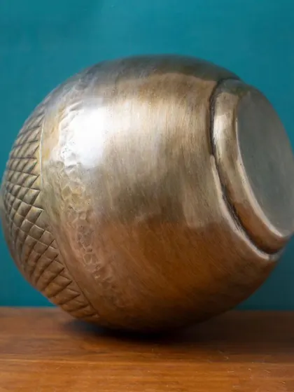 The handcrafted detail of the Vihaan planter is evident from every angle. The combination of smooth and patterned surfaces creates a dynamic and interesting visual.