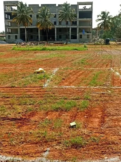 The initial ground marking for a sports court at a school in Sarjapura, the very first step in transforming an empty field into a functional athletic facility.