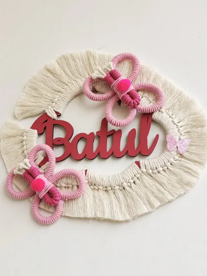The finished "Batul" name hanging, a beautiful and unique piece of nursery decor. The pink butterflies add such a sweet and delicate touch.