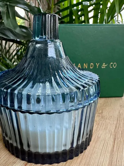 A close-up of the beautiful blue ribbed glass container for my vanilla candle. The quality of the vessel is just as important as the candle inside.