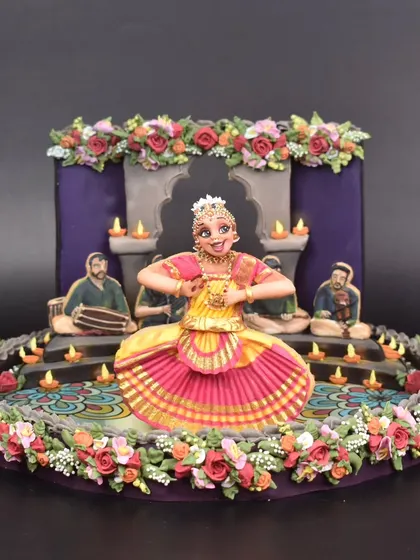 The final competition piece, a 3D cookie art display depicting a Bharatanatyam Arangetram. Though I didn't win, I'm incredibly proud of the final result and the techniques I learned while creating it.