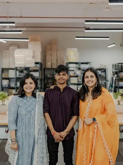 With one of our first team members in the new office. Our team is the heart of our business, and we couldn't have reached this milestone without them.