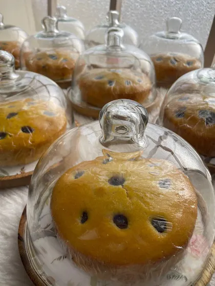 My lemon blueberry tea cakes are very popular as return favors. Here they are packed in individual glass cloches, which makes for a very elegant party gift.