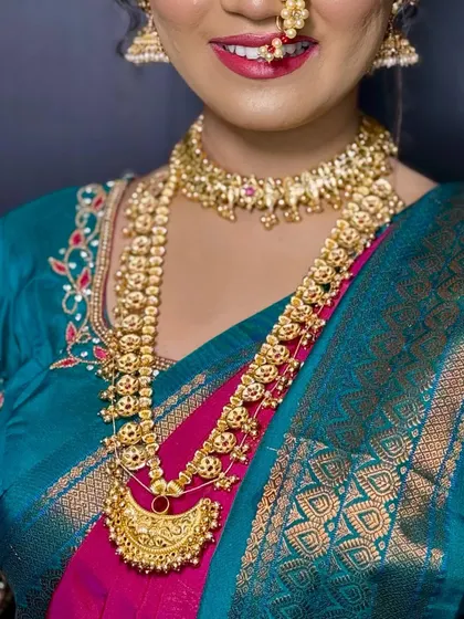 A detailed shot of a traditional Maharashtrian gold-finish necklace. I offer a wide range of authentic temple and traditional jewellery for rent.