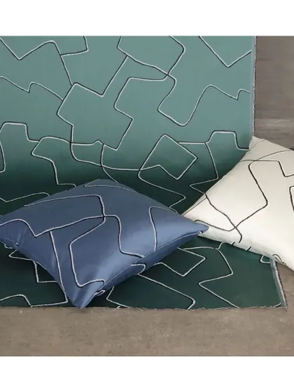 For fans of modern prints, the 'Improv' fabric is a perfect choice. Available in vibrant metallic hues, its abstract, embroidered lines add a hint of subtle glamour to cushions and upholstery.