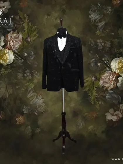 A luxurious black velvet tuxedo for the groom, meticulously crafted with stunning appliqué with pearls and crystals.