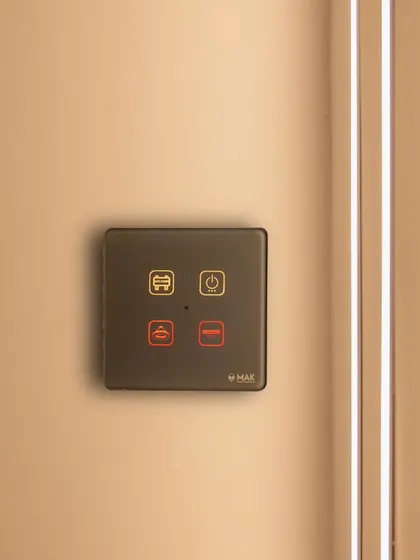 A compact, four-button smart panel in black, ideal for smaller spaces or for controlling specific scenes like 'reading mode' or 'goodbye'.