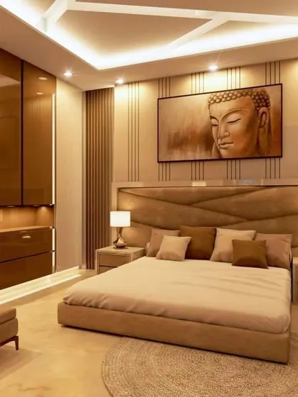I designed this serene bedroom with a calming Buddha artwork above the bed. The warm, indirect lighting from the false ceiling and the paneled walls create a peaceful and meditative ambiance.
