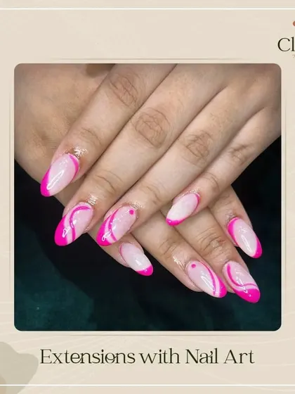 Pretty in pink. These extensions feature a playful and artistic pink swirl design, showing how we can customize your nails to be both long and creative.