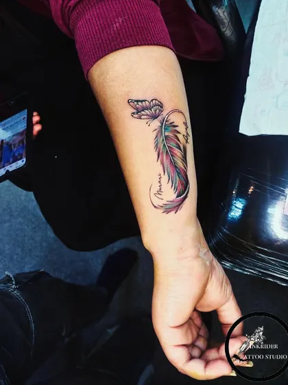 A beautiful combination of a colorful feather and a butterfly. This design symbolizes transformation, freedom, and beauty.