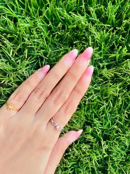A beautiful set of pink ombre nails, perfect for any occasion. The subtle fade from pink to white is a classic and elegant look.