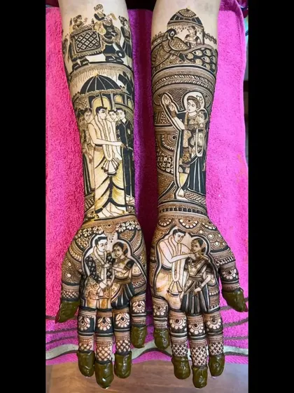 The dark, rich color of the henna enhances the detailed figures in this bridal design. It features multiple couple portraits and scenes from their wedding day.