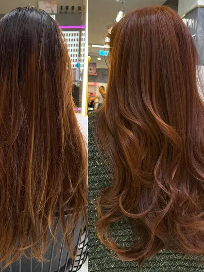 A side-by-side before and after of a major color correction. We transformed her hair from dry and brassy to a rich, vibrant, and healthy-looking amber red.