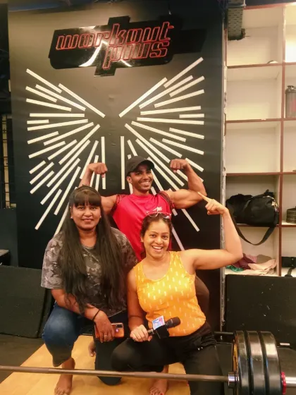 Posing with some of the strong participants at the gym event. My role is to be a hype-person, encouraging everyone and making the fitness challenge a fun and rewarding experience.