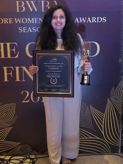 Holding my certificate and trophy from the Bangalore Women Brand Awards. I feel so grateful for these milestones and for the opportunity to meet other impressive women entrepreneurs.