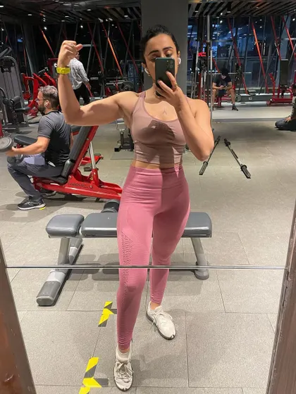 Capturing the results of consistent effort in the gym mirror. Each session is a step towards your personal fitness goals.