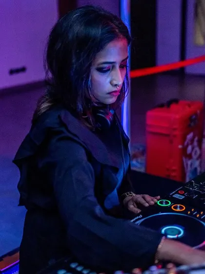 A close-up of me at the decks during an extended closing set. These late-night sessions are where I can really explore the deeper, more hypnotic side of my music collection.
