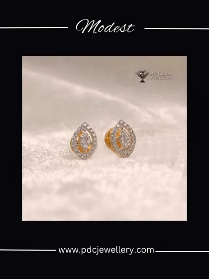 Modest yet beautiful, these 18kt hallmarked gold and diamond earrings feature a leaf-like or 'paan' shape, perfect for a touch of traditional elegance.