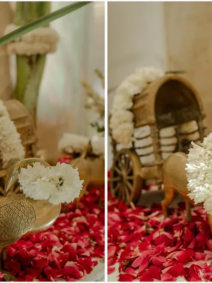 Adorable wooden decor pieces, like these sheep and a cart, decorated with fresh jasmine flowers.