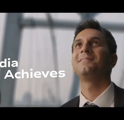 Another inspiring shot from the Air India "India Achieves" campaign. The character's hopeful expression is the centerpiece of this frame.