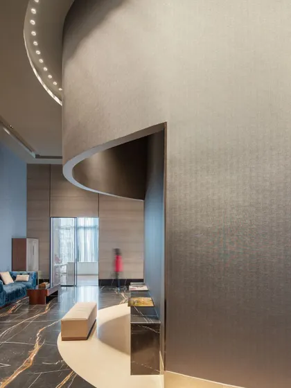 The curved walls and flowing circulation paths at the Godrej South Estate Experience Centre create a sense of organic movement. This image captures how the architecture itself guides visitors through the space without the need for signs.