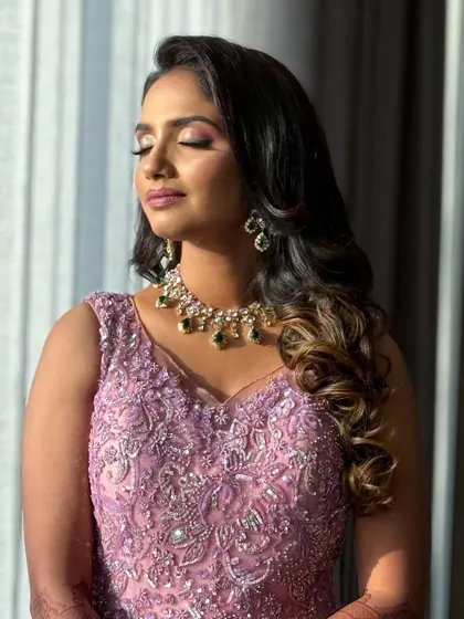 A sun-kissed shot of the client, her eyes closed to show the beautiful eyeshadow work.