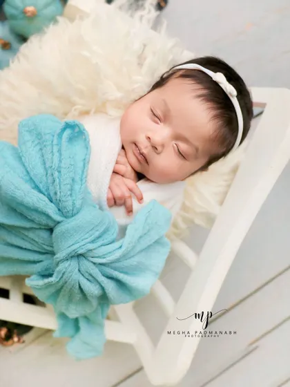 A close-up on the baby's peaceful, sleeping face.