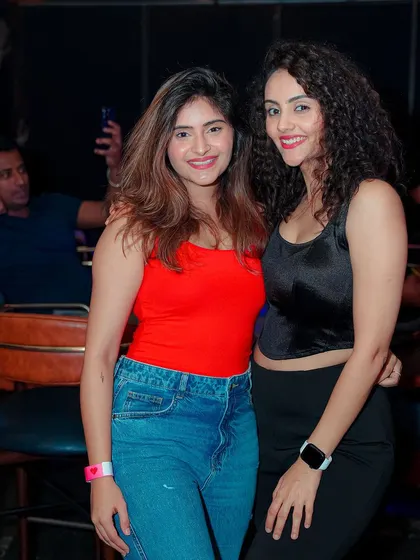 Two women posing and smiling during a club night. I love seeing people feeling confident and happy.