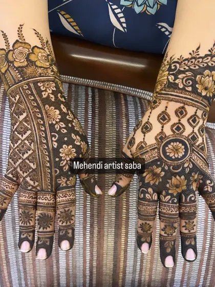 This design shows two different styles on each hand. One features a geometric pattern, while the other has a more organic, floral look, showcasing variety.