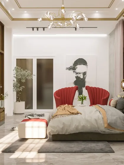 A wide shot of the 'Golden Glam' bedroom, showing the spacious layout and the harmonious blend of red, gold, and neutral tones.